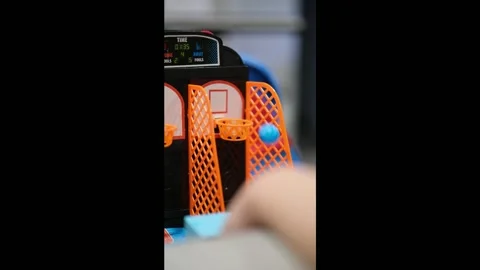 Playing a mini basketball game close up Stock Footage 328117207