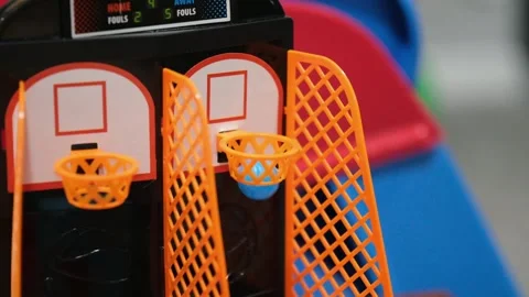 Playing a mini basketball game close up Stock Footage 328117210