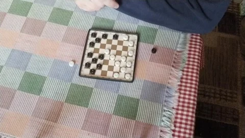 Playing mini checkers Stock Footage 255449539