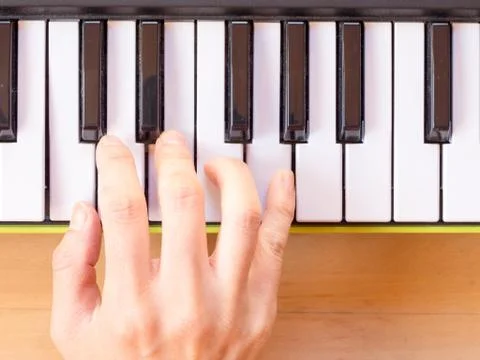 Playing mini digital piano, C Stock Photos