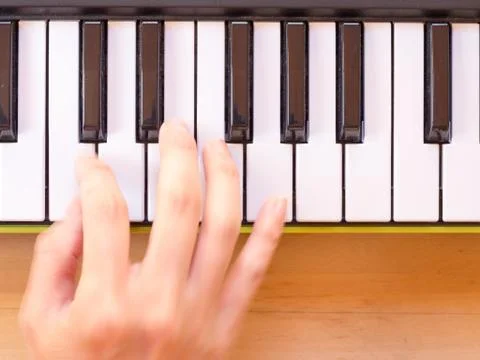 Playing mini digital piano Stock Photos
