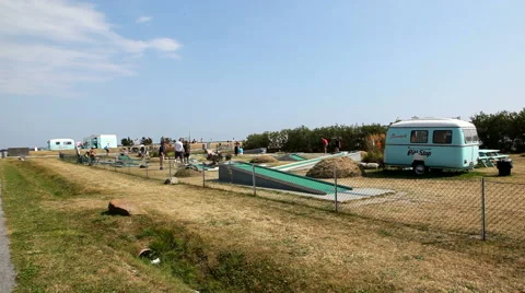 Playing mini golf on the beach Stock Footage 40581202