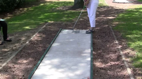 Playing mini golf Stock Footage 6531485