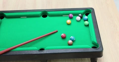 Playing miniature billiards in a board game Stock Footage 291920985