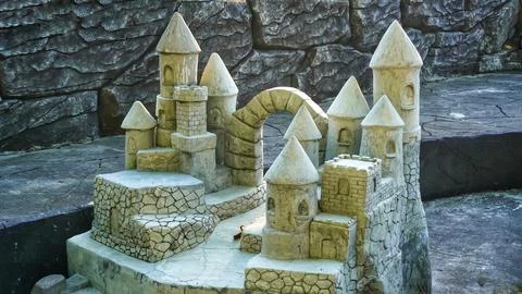 Playing at the Miniature Castle: A Captivating Experience for Children Stock Photos