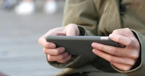 Playing mobile game on cellphone Stock Footage 83481646