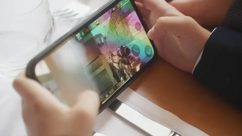 Playing mobile game on smartphone. Stock Footage 254547143