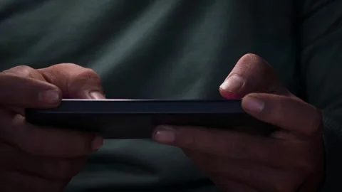 Playing a mobile game on a smartphone Stock Footage 339831019