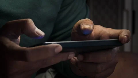 Playing a mobile game on a smartphone Stock Footage 339831081