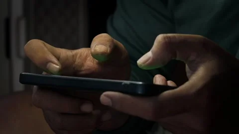 Playing a mobile game on a smartphone Stock Footage 339831089