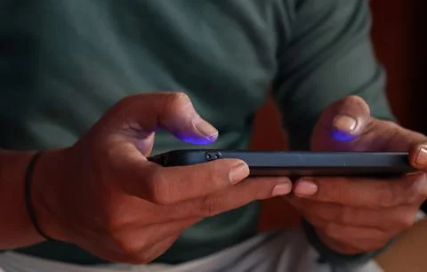 Playing a mobile game on a smartphone Stock Photos