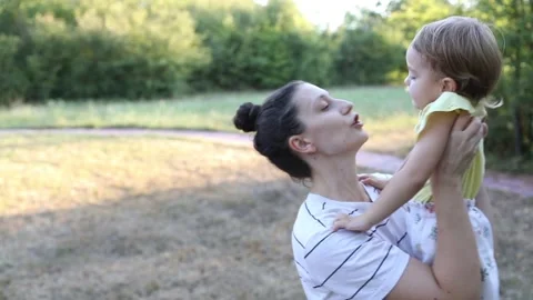Playing with mom in the park Stock Footage 288075060