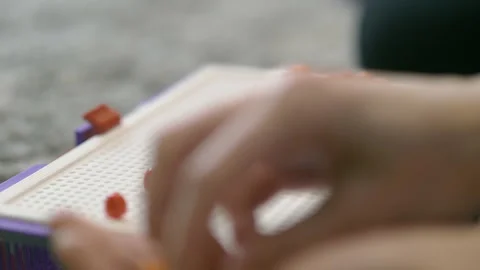 Playing with mosaics, making words, entertainment for kids and grown-ups Stock Footage 157106942