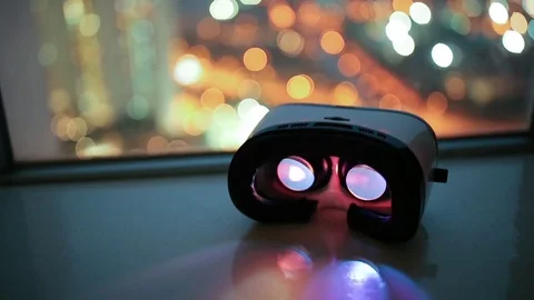 Playing movie inside virtual reality device at night Stock Footage 73148019