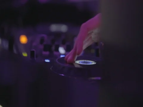 Playing music on a dj console Stock Footage 80630825