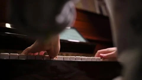Playing a musical instrument. Reading notes from an electronic tablet. Stock Footage 262969811
