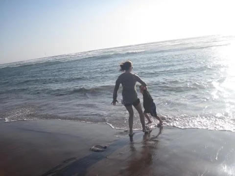 Playing in the ocean Stock Photos