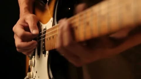 Playing old electrical guitar solo in black Stock Footage 10677995