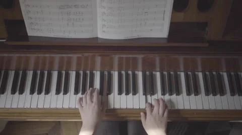 Playing an old piano, birdview Stock Footage 55342770
