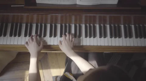 Playing an old piano, birdview Stock Footage 55342811