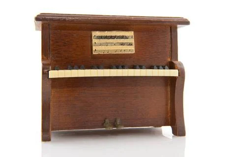 Playing the old piano Playing at the old brown piano instrument Copyright:... Stock Photos
