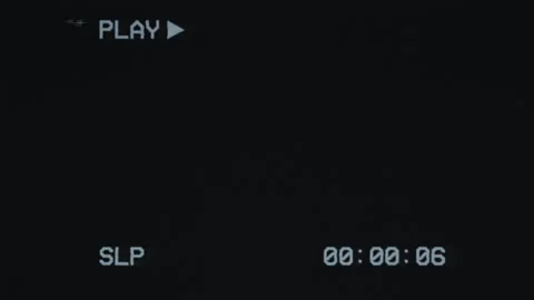 Playing an old, poor-quality VHS cassette. Old black screen with text 'PLAY' and Stock Footage 244797128