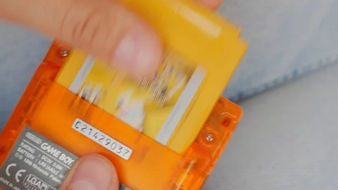 Playing on old school, retro game console, gameboy Stock-Footage 95020177