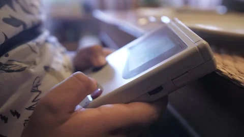 Playing with original nintendo game boy 90s console 4k Stock Footage 281853784