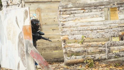 Playing paintball in the Woods Stock Footage 93330177