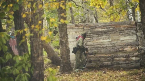 Playing paintball in the Woods Video stock 93330496
