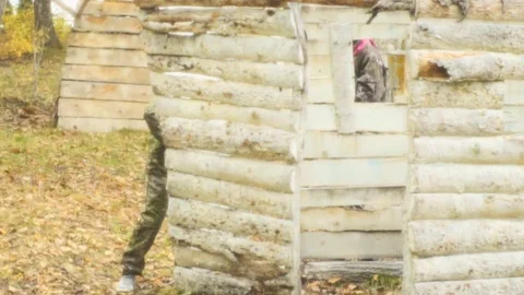 Playing paintball in the Woods Stock Footage 93332213