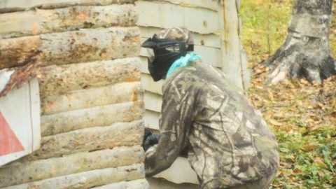 Playing paintball in the Woods Stock Footage 93332515