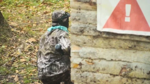 Playing paintball in the Woods Stock Footage 93332895