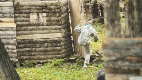 Playing paintball in the Woods Stock Footage 93333049