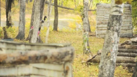 Playing paintball in the Woods Stock Footage 93333167