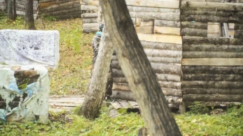 Playing paintball in the Woods Stock Footage 93333716