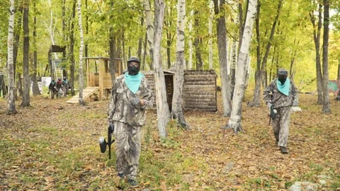 Playing paintball in the Woods Stock Footage 93334027