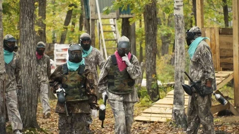 Playing paintball in the Woods Stock Footage 93334236