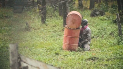 Playing paintball in the Woods Stock Footage 115098039