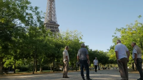 Playing Pétanque in the Parc du Champ de Mars in front of the Eiffel Tower Stock Footage 95865879