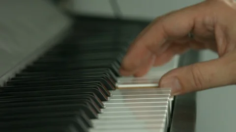 Playing on piano keyboard Video stock 107384435