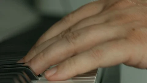 Playing on piano keyboard Vídeo Stock 107384858