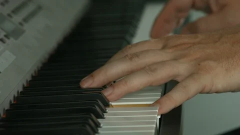 Playing on piano keyboard Vídeo Stock 107385730