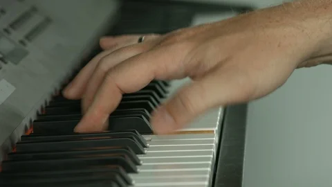 Playing on piano keyboard Vídeo Stock 107386260