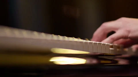 Playing the piano. The musician performs the composition. Hands visible close up Stock Footage 182369700