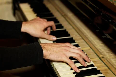 Playing on a Piano Stock Photos