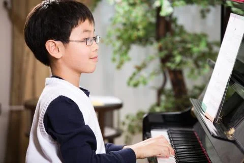 Playing piano Stock Photos