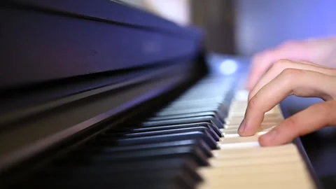 Playing piano in slow motion Stock Footage 331467608