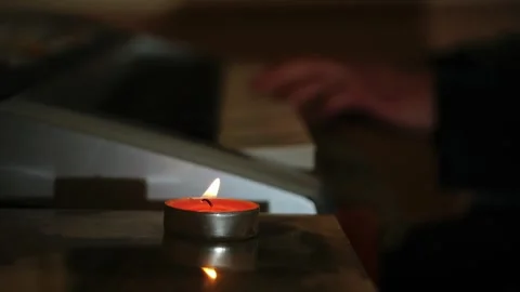Playing piano with tealight candle Stock Footage 295798653