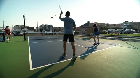Playing Pickle ball doubles Stock Footage 95687146